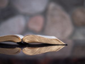 Bible open of a glass surface