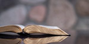 Bible open of a glass surface